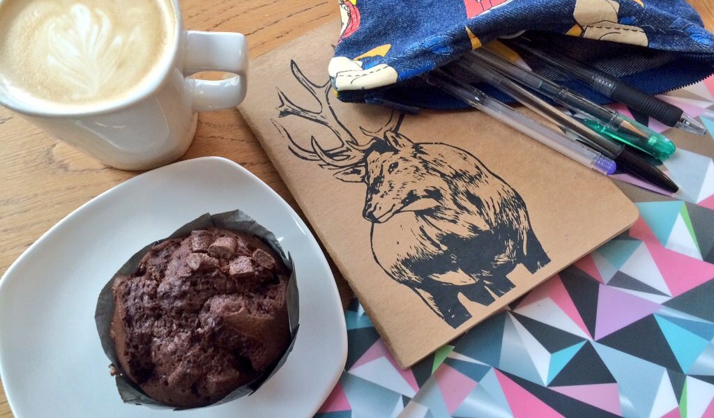 writing in cafes - notebooks and coffee