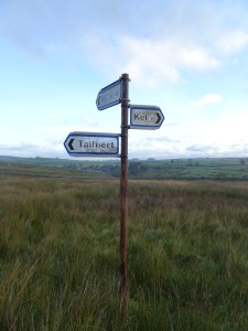 finger signpost in the middle of the fell, pointing towards Keld, Tailbert and Rayside